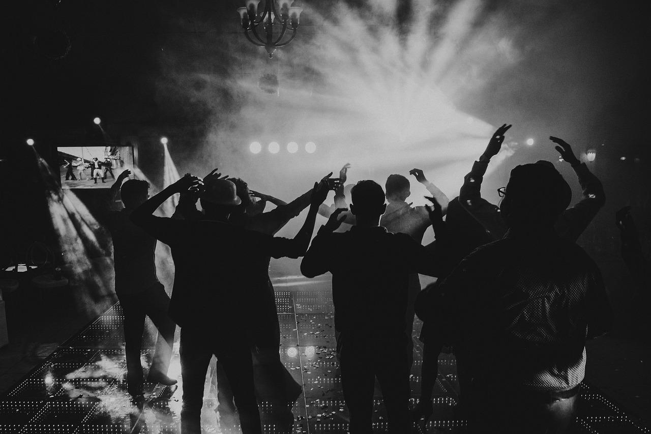Strobe-lit club crowd at night
